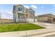 Two-story house with a two-car garage, landscaping, and a front yard at 7548 E 159Th Pl, Thornton, CO 80602