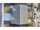 An aerial view of the house showing the roof, driveway, and backyard with a deck at 1825 Wingfeather Ln, Castle Rock, CO 80108