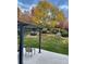 Inviting backyard with lush lawn, mature trees, and outdoor seating area for relaxing and entertaining at 4349 S Genoa Ct, Centennial, CO 80015