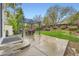 Outdoor patio area featuring a pergola with a table and chairs, perfect for entertaining at 4349 S Genoa Ct, Centennial, CO 80015