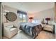 Neutral bedroom with a large window, a comfy chair, and ample space at 4349 S Genoa Ct, Centennial, CO 80015