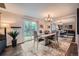 Elegant dining room with a sliding door to the backyard and a large mirror, creating an inviting atmosphere at 4349 S Genoa Ct, Centennial, CO 80015