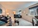 Comfortable living room with two couches, side tables and glass coffee table at 4349 S Genoa Ct, Centennial, CO 80015