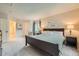 Spacious main bedroom with ensuite bath access, a picture window, and neutral decor at 4349 S Genoa Ct, Centennial, CO 80015