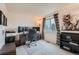 Home office with a large desk, multiple monitors, natural light and built-in storage at 4349 S Genoa Ct, Centennial, CO 80015