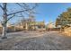 Large backyard with patio and mature trees at 1584 S Vaughn Cir, Aurora, CO 80012