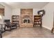 Finished basement recreation area with fireplace and built-in shelving at 1584 S Vaughn Cir, Aurora, CO 80012