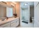 Clean bathroom with a large shower and updated vanity at 1584 S Vaughn Cir, Aurora, CO 80012