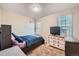 Well-lit bedroom with a double bed and dresser at 1584 S Vaughn Cir, Aurora, CO 80012