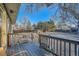 Wooden deck overlooking backyard with access to patio at 1584 S Vaughn Cir, Aurora, CO 80012