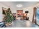 Cozy Gathering room featuring a brick fireplace and built-in shelving at 1584 S Vaughn Cir, Aurora, CO 80012