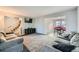 Open concept living space with a view into the dining area and kitchen at 1584 S Vaughn Cir, Aurora, CO 80012