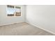 Spacious bedroom with neutral carpeting and large window at 8888 Salida St, Commerce City, CO 80022