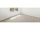 Simple bedroom with new carpet and window at 8888 Salida St, Commerce City, CO 80022