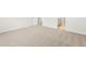Primary bedroom with neutral carpeting and access to bathroom at 8888 Salida St, Commerce City, CO 80022