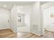 Main hallway with light walls and vinyl plank flooring at 8888 Salida St, Commerce City, CO 80022