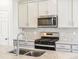 Kitchen area with stainless steel appliances and sink at 8888 Salida St, Commerce City, CO 80022