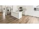 Open concept kitchen with island and hardwood floors at 8888 Salida St, Commerce City, CO 80022