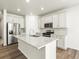 Modern kitchen with white cabinets, granite countertops, and stainless steel appliances at 8888 Salida St, Commerce City, CO 80022