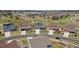 Areal view showcasing a neighborhood with neatly arranged homes, manicured lawns, and well-maintained streets at 23883 E Minnow Cir, Aurora, CO 80016