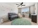 Charming Bedroom with sea-themed decor, a gray crib, and a cozy armchair for a peaceful and imaginative space at 23883 E Minnow Cir, Aurora, CO 80016