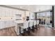 Bright kitchen with a center island, seating, and an adjacent dining area, perfect for Gathering meals at 23883 E Minnow Cir, Aurora, CO 80016