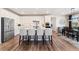 Modern kitchen with white cabinets, stainless steel appliances, and a large center island at 23883 E Minnow Cir, Aurora, CO 80016