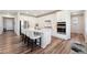 Modern kitchen featuring white cabinets, a center island with seating, and stainless steel appliances at 23883 E Minnow Cir, Aurora, CO 80016