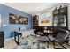 Bright office space with a desk, cozy seating, and stylish decor at 23883 E Minnow Cir, Aurora, CO 80016