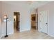 Bright bedroom features wood floors, neutral walls, and an open doorway to an adjacent room at 3040 W Prentice Ave # B, Littleton, CO 80123