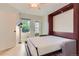 Bedroom with murphy bed extended, ceiling fan, and access to outdoor patio at 3040 W Prentice Ave # B, Littleton, CO 80123