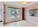 Bedroom with two windows overlooking a pool, built in shelves, and light walls at 3040 W Prentice Ave # B, Littleton, CO 80123