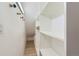 Walk-in closet features built in shelving, hardwood floors and unique hardware at 3040 W Prentice Ave # B, Littleton, CO 80123
