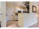 Bright kitchenette features white cabinetry and modern lighting at 3040 W Prentice Ave # B, Littleton, CO 80123