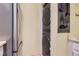 Modern laundry closet featuring a stackable washer and dryer set for space-saving convenience at 3040 W Prentice Ave # B, Littleton, CO 80123