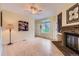 Living room with light yellow walls, a brick fireplace, and hardwood floors at 3040 W Prentice Ave # B, Littleton, CO 80123