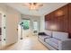 Bright living room features a ceiling fan, hardwood floors, and a built in murphy bed at 3040 W Prentice Ave # B, Littleton, CO 80123