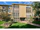 Building exterior with beautiful garden and lawn at 13500 E Cornell Ave # 302, Aurora, CO 80014