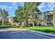 Well-maintained building with mature trees and landscaping at 13500 E Cornell Ave # 302, Aurora, CO 80014