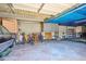 Spacious garage filled with storage items and vehicles, providing ample space at 13500 E Cornell Ave # 302, Aurora, CO 80014