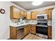 Functional kitchen featuring modern stainless steel appliances at 13500 E Cornell Ave # 302, Aurora, CO 80014