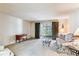 Spacious living room with sliding glass door and natural light at 13500 E Cornell Ave # 302, Aurora, CO 80014