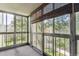 Bright sunroom enclosed with large windows showcasing outdoor views and letting in natural light at 13500 E Cornell Ave # 302, Aurora, CO 80014