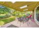 Covered back patio area with outdoor seating, perfect for relaxing and entertaining at 13934 W Warren Dr, Lakewood, CO 80228
