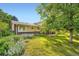 Lush backyard with flowers and back patio, an inviting outdoor space at 13934 W Warren Dr, Lakewood, CO 80228