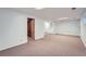 Finished basement space with white walls, providing a blank canvas for various uses at 13934 W Warren Dr, Lakewood, CO 80228