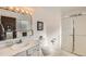 Clean bathroom featuring a shower, vanity, and neutral finishes at 13934 W Warren Dr, Lakewood, CO 80228