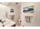 Stylish bathroom with modern fixtures and artwork on the walls at 13934 W Warren Dr, Lakewood, CO 80228