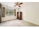 Bedroom with neutral carpet and a bright window with tree views at 13934 W Warren Dr, Lakewood, CO 80228