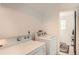 Laundry room with washer and dryer hookups near a doorway and ample space at 13934 W Warren Dr, Lakewood, CO 80228